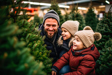 Family Buying A Christmas Tree At A Street Stall