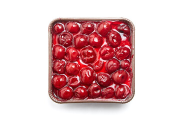 Mini cherry pie in tray isolated on white, top view. Biscuit cake with cherries under jelly. Mini pie with a vibrant burst of cherry-red