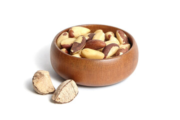 Wall Mural - Brazil nuts in wooden bowl isolated on white. Peeled brazil nuts.