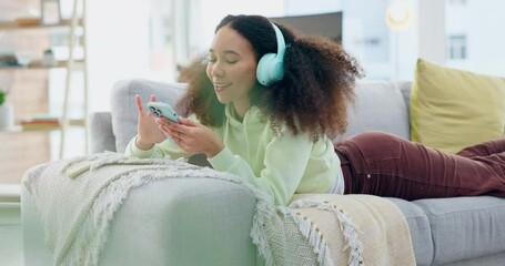 Canvas Print - Phone music, sofa and happy woman relax, listening and streaming sound track, radio network or audio. Cellphone, wellness and gen z person search online for podcast, playlist and lying on home coach