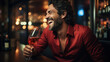 Cheerful man in red silk shirt with a glass of wine. Easy rider guy gigolo macho.