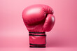 boxing glove on pink Background. Breast cancer awareness concept