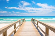 Destin, Florida Showcases A Charming Boardwalk That Offers A Stunning Perspective Of A Beach House And The Vast Expanse Of The Ocean. A Wooden Pathway Extends Along The Exterior Of The Beach House