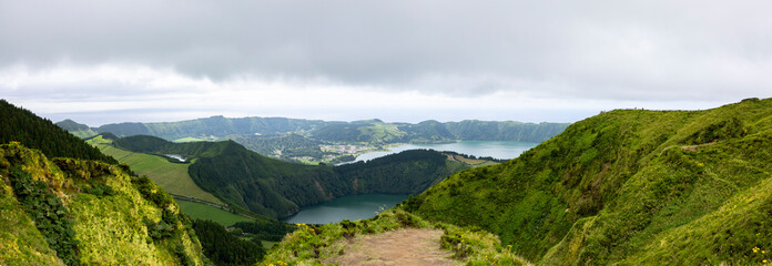 Wall Mural - Panoramic landscape view of Twin Lakes of Sete Cidades from Boca do Inferno viewpoint in the island of Sao Miguel, Azores, Portugal