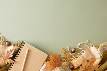 Sticker - Immerse yourself in the comforts of fall at home. Top view composition of warm plaid, notebook, pen, acorns, yellow autumn leaves on pastel olive background with empty space for promo or text