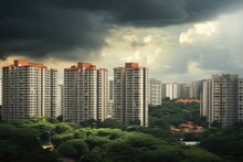 The Kallang Neighborhood In Singapore Showcases A Residential Condominium Building Complex And City Skyline, With Stormy Clouds Above.