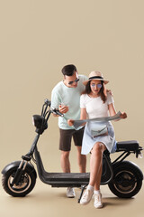 Poster - Young couple with map and electric bike on green background