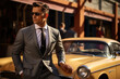A man in a tailored suit shades and watch posing on the hood of an oldfashioned vintage car with other classic vehicles seen behind
