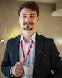 © Miljan Živković - One man caucasian male adult stand with cup of coffee in hotel room