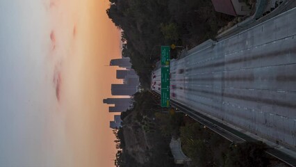 Wall Mural - Vertical View Of Traffic In The Highway During Sunset In Los Angeles, California during covid 19 lockdown. - timelapse