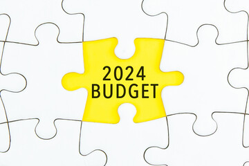 Business concept - 2024 BUDGET word on a jigsaw puzzle background.