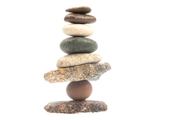 Wall Mural - pyramid of stacked stones on a white background. stabilization and balance in life