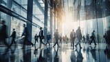 Fototapeta Sypialnia - Blurred group of busy business people moving through a corporate office space