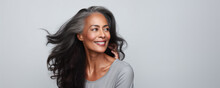 Beautiful Black Woman With Smooth Healthy Face Skin. Gorgeous Aging Mature Woman With Long Gray Hair And Happy Smiling. Beauty And Cosmetics Skincare Advertising Concept.
