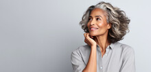 Dark Skin Woman With Smooth Healthy Face Skin. Beautiful Aging Mature Woman With Long Gray Hair And Happy Smiling, Beauty And Cosmetics Advertising Concept.