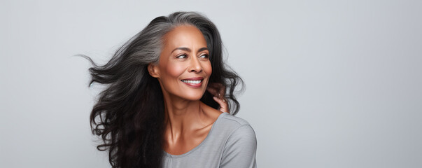 beautiful black woman with smooth healthy face skin. gorgeous aging mature woman with long gray hair
