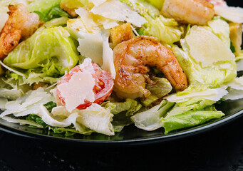 Wall Mural - Caesar salad with grilled shrimp and parmesan cheese