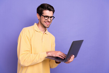 Aufkleber - Photo of confident funny guy wear yellow shirt working modern gadget empty space isolated violet color background