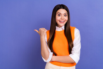 Sticker - Photo of cute astonished girl toothy smile indicate thumb finger empty space isolated on violet color background