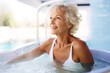 © Kalim - AI generated image of mature senior woman in jacuzzi