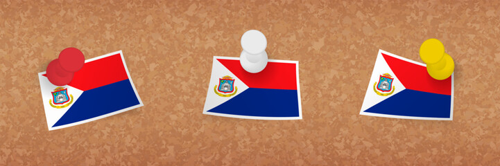 Sticker - Sint Maarten flag pinned in cork board, three versions of Sint Maarten flag.