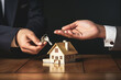 Estate agent handing over keys to buyer