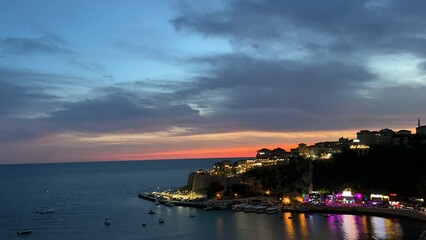 Canvas Print - View of the evening town at sunset, Montenegro, Ulcinj, time lapse.