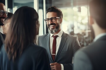 Wall Mural - Smiling laughing colleagues businessmen businesswomen meeting discuss friendly dialogue cooperation strategy brainstorm planning business diversity talking working together partnership communication