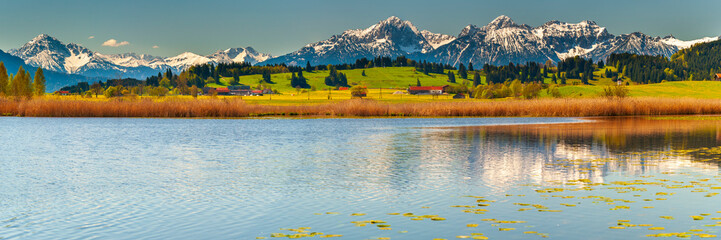 Wall Mural - panoramic view to rural landscape with mountain range and lake at autumn