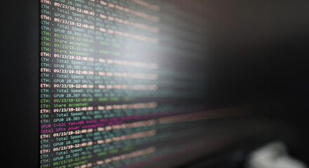 Program for mining cryptocurrencies on a computer monitor closeup background