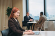 © NewSaetiew - Portrait of businesswoman discussion and meeting with computer in office. Smiling beautiful female sitting in front of workplace. Using labtop during a meeting.