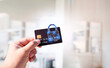 © BLKstudio - Close up of man hand holding credit or debit card with padlock, protection of financial transactions, copy space, Financial security technology concept.