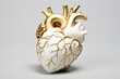 Porcelain ceramic anatomical heart with golden details