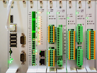 Wall Mural - Electrical equipment. Programmable controller. Automation of production machines. Place to connect wires to equipment. Factory programmable controller. Industrial electrical equipment