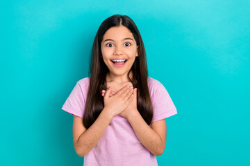 Wall Mural - Photo of impressed funky small kid wear pink t-shirt arms chest open mouth isolated turquoise color background