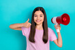 Photo of young little schoolgirl bullhorn thumb up recommendation promoter shopping advertiser kids store isolated on cyan color background