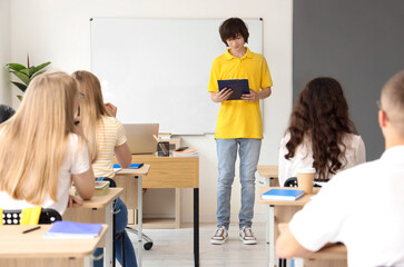 Poster - Group of students having lesson in classroom