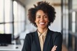 © Baba Images - Portrait of a middle aged woman of african ethnicity looking at camera in the office