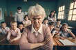 © SandrisK - Portrait of angry old teacher in a class at elementary school.