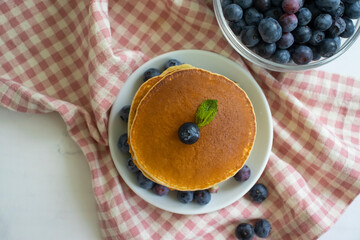 Wall Mural - Pancakes with blueberries in a bowl