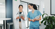 © SneakyPeakPoints/peopleimages.com - Talking doctor, walking or nurse on tablet in busy hospital teamwork, women collaboration or bonding with surgery joke. Smile, happy or laughing healthcare workers on medical technology meme or comic