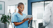 © SneakyPeakPoints/peopleimages.com - Happy woman or black doctor face in busy hospital with tablet for healthcare services, leadership and mindset. Portrait of medical professional or female nurse on telehealth app for clinic management