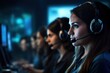© Bojan - Closeup of female call center agent wearing headset working on computer in row with her colleagues at office.