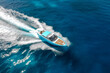 Aerial drone view of luxury rigid inflatable speed boat cruising in high speed in deep blue sea