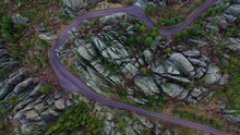 Top Down Aerial Of A Scenic Drive With A Purplish Hue In The Black Hills