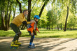 © Nomad_Soul - Elderly man enjoying sports in sunny summer park with his little son