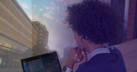 Poster - Animation of biracial businesswoman with laptop over cityscape