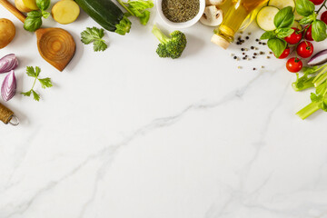 Poster - Food cooking ingredients background with fresh vegetables, herbs, spices and olive oil on marble table with copy space top view. Healthy vegetarian eating