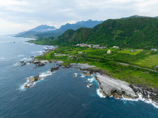 Sticker - Drone fly over Taiwan Hualien rice field over the sea in Fengbin Township, Shitiping Coastal Stone Step Plain