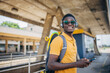 © ChaoticMind - Young man with skateboard waiting for train